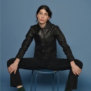 Snap front chic leather jacket. Never worn new. Size medium.